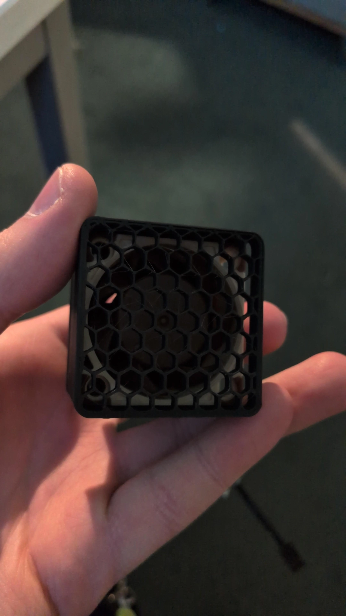 same 3d printed casing from the front showing a noctua 40mm fan through a hexagon grill